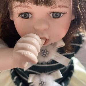 TOPP Collection Sitting Porcelain Doll Thumb Sucking